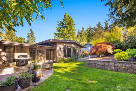 an aerial view of a house with a yard and a fountain