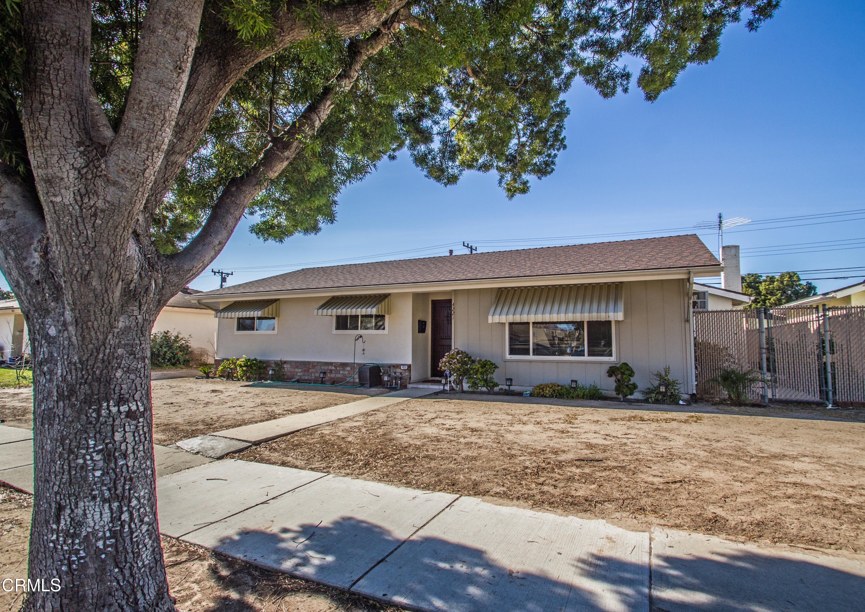 4221 Olds Road Oxnard, CA 93033 - Photo 1 of 34 a front view of a house with a yard