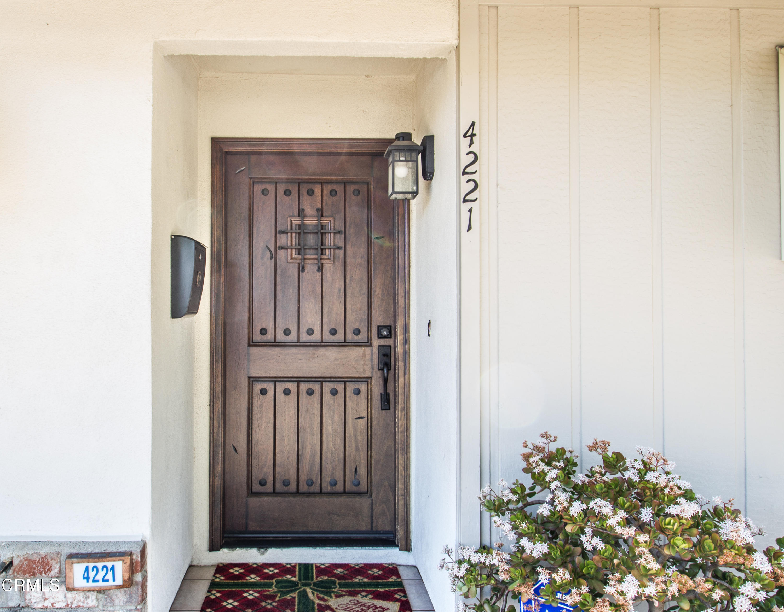 4221 Olds Road Oxnard, CA 93033 - Photo 2 of 34 a view of a hallway with wooden floor and a potted plant