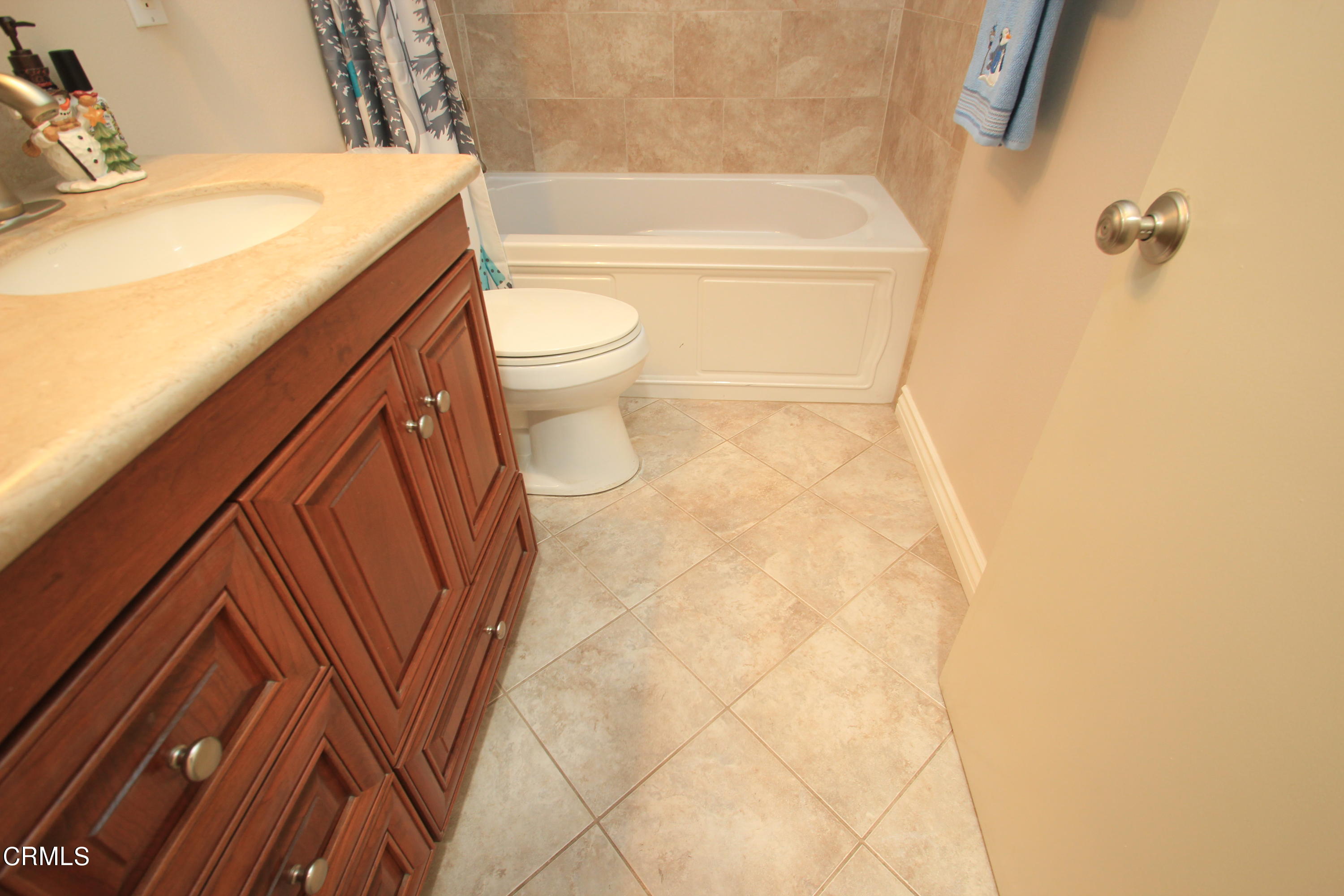 4221 Olds Road Oxnard, CA 93033 - Photo 13 of 34 a bathroom with a sink a toilet and bathtub