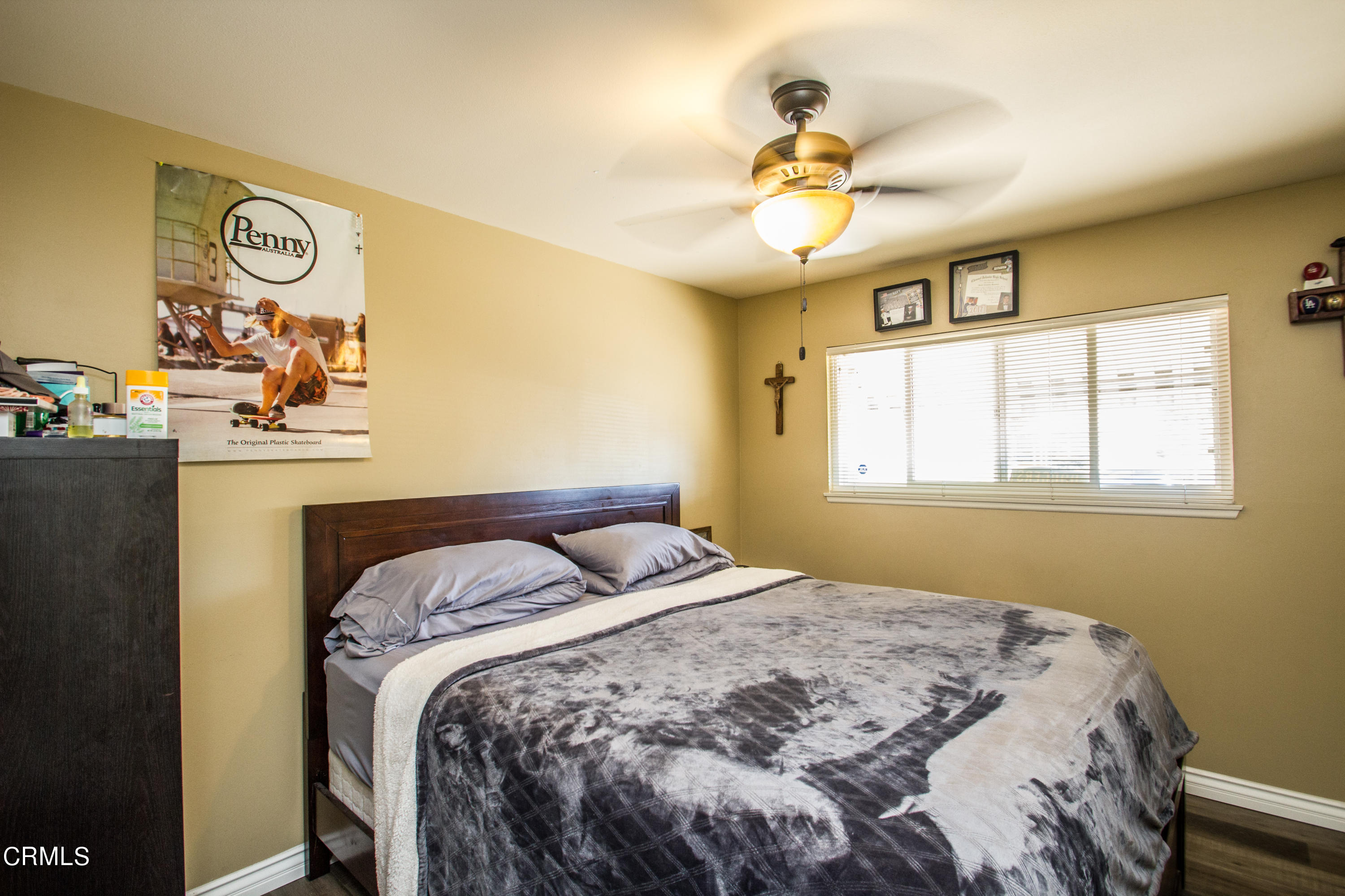 4221 Olds Road Oxnard, CA 93033 - Photo 15 of 34 a bedroom with a bed and a chandelier