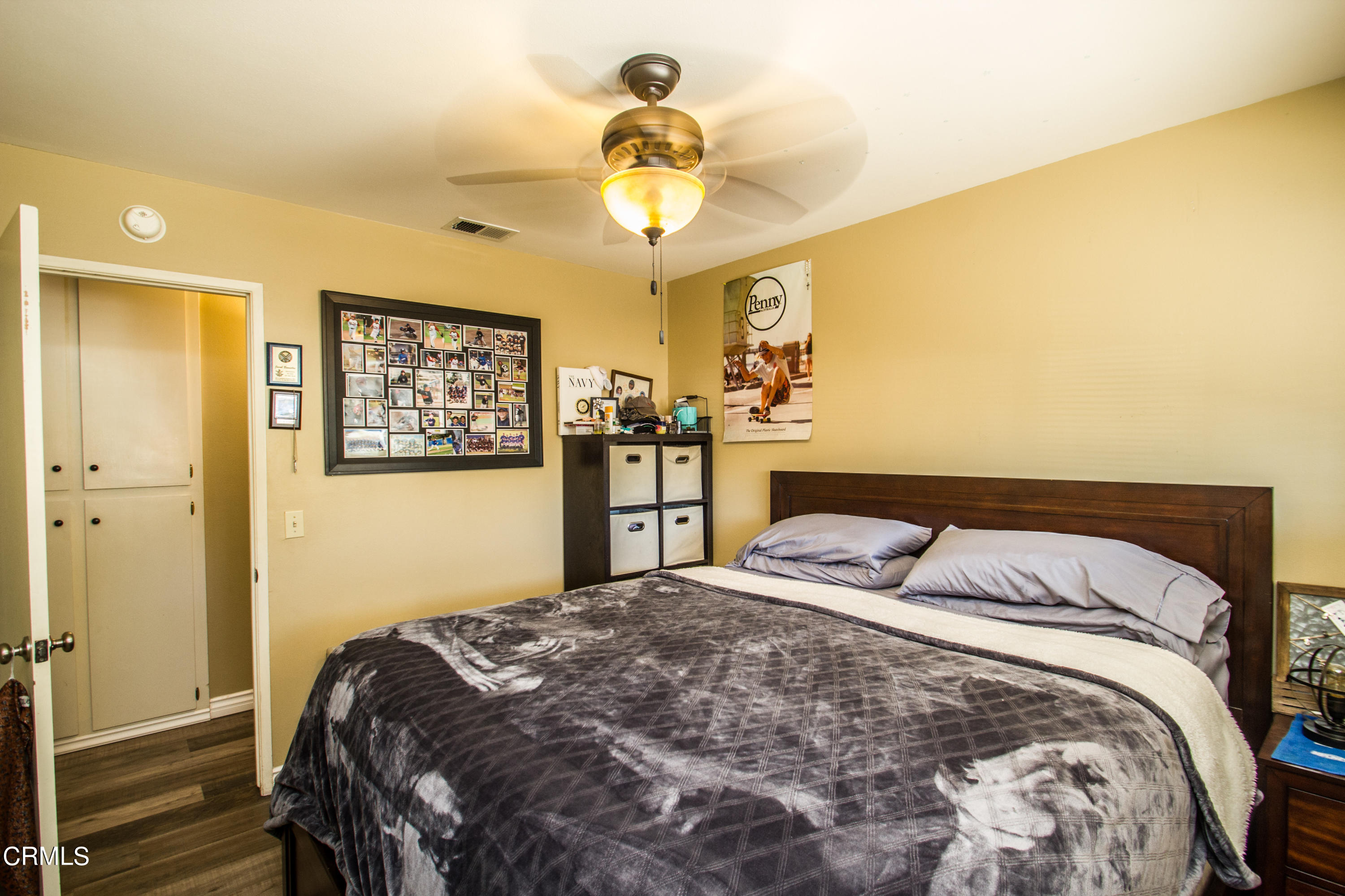 4221 Olds Road Oxnard, CA 93033 - Photo 16 of 34 a bedroom with a bed and a chandelier
