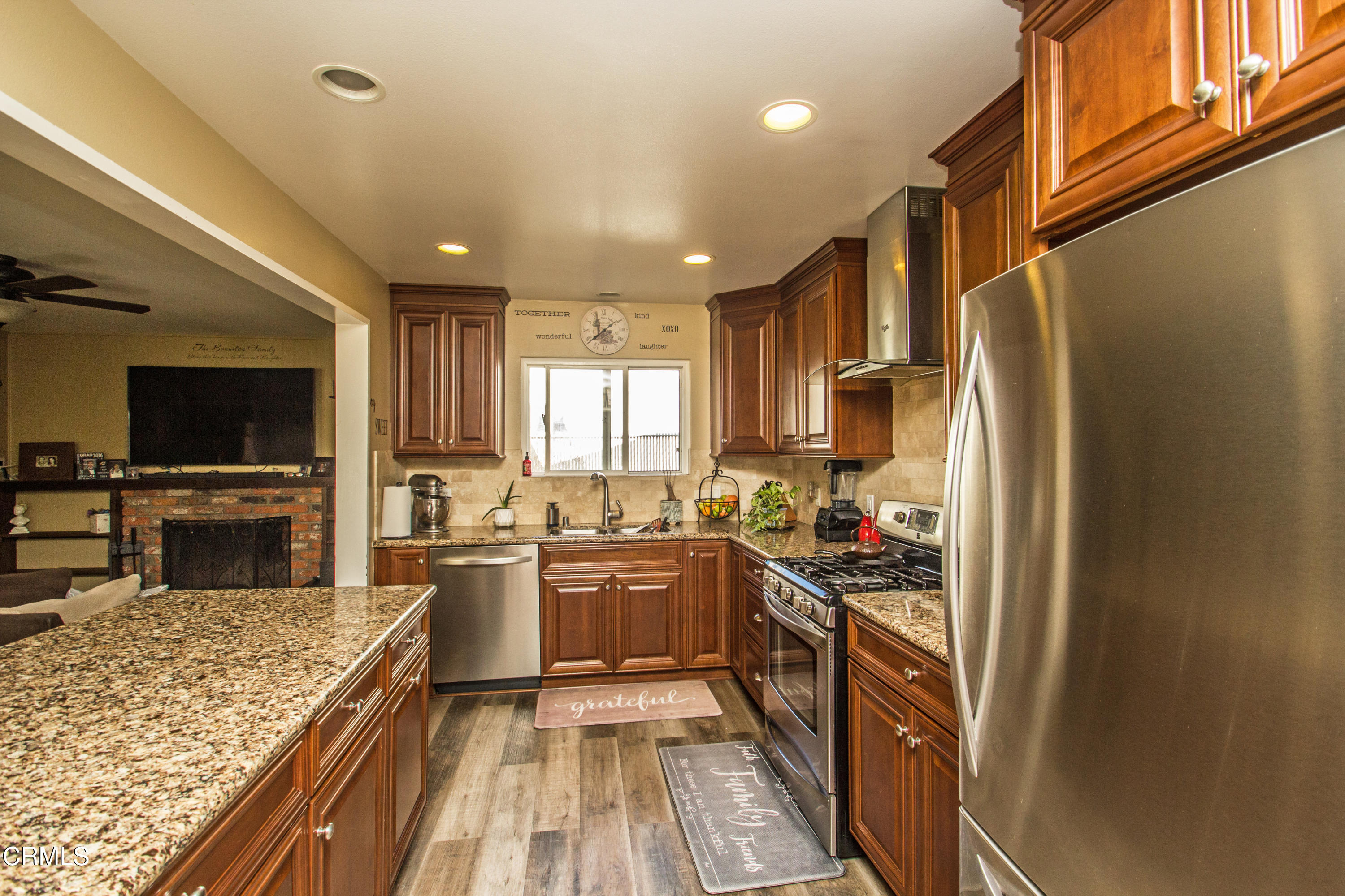 4221 Olds Road Oxnard, CA 93033 - Photo 19 of 34 a kitchen with lots of counter top space appliances and a center