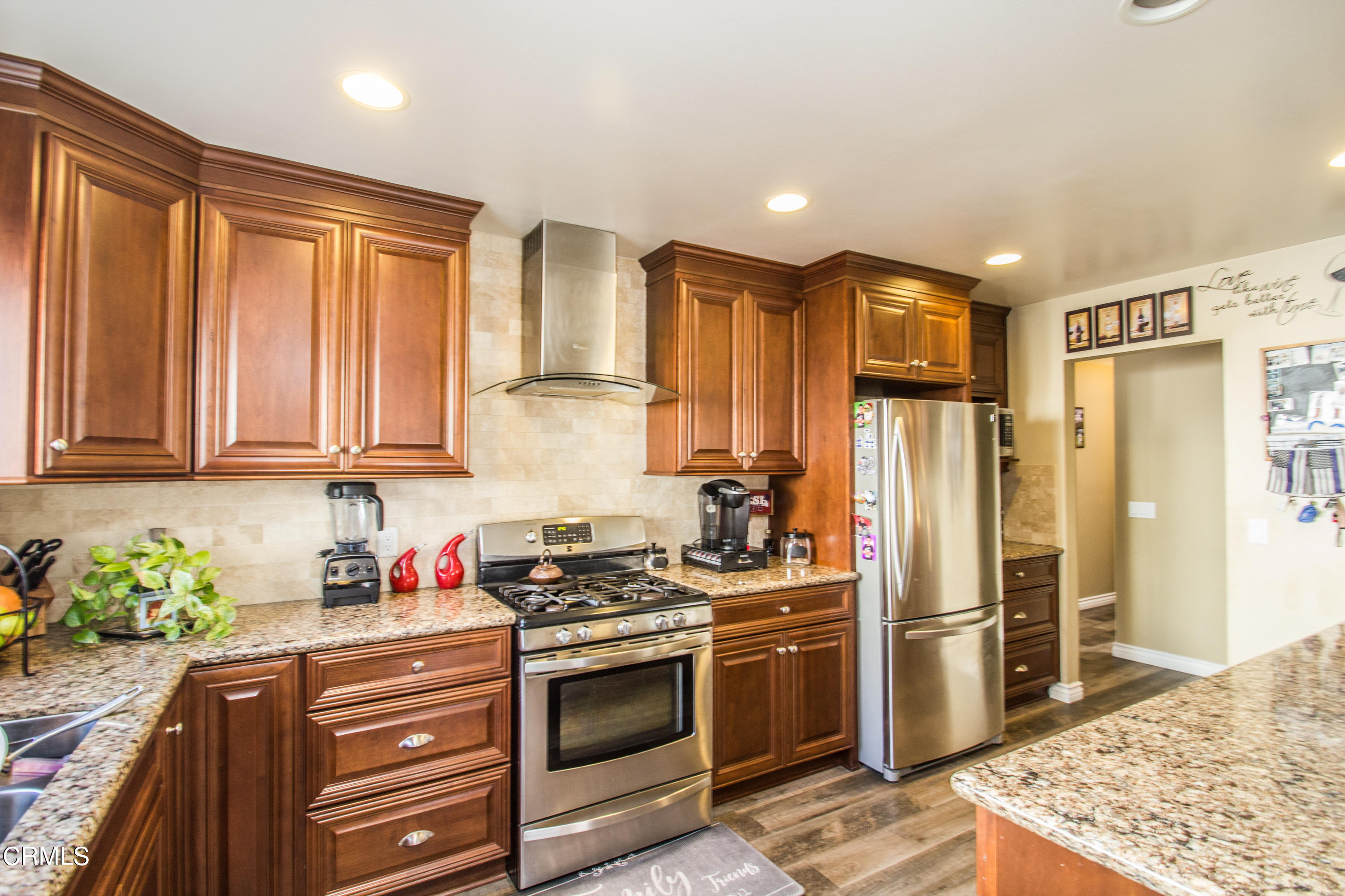 4221 Olds Road Oxnard, CA 93033 - Photo 20 of 34 a kitchen with stainless steel appliances granite countertop a refrigerator sink and stove