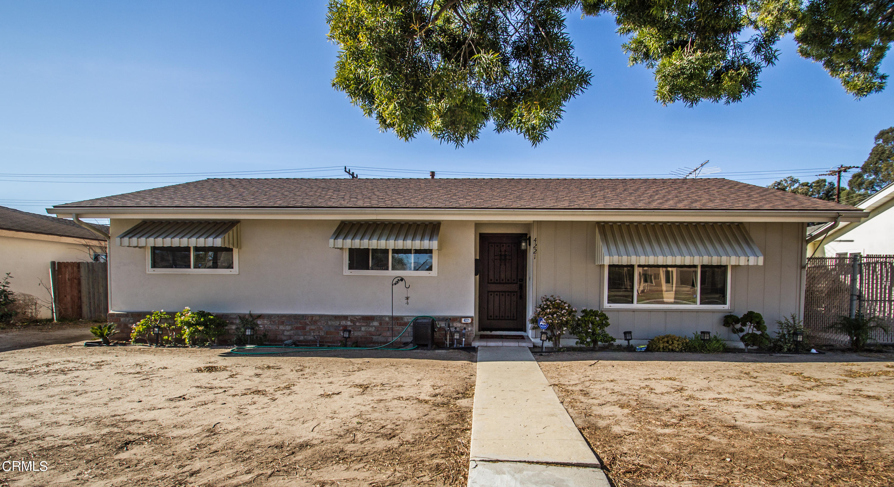 4221 Olds Road Oxnard, CA 93033 - Photo 3 of 34 a front view of a house with a yard
