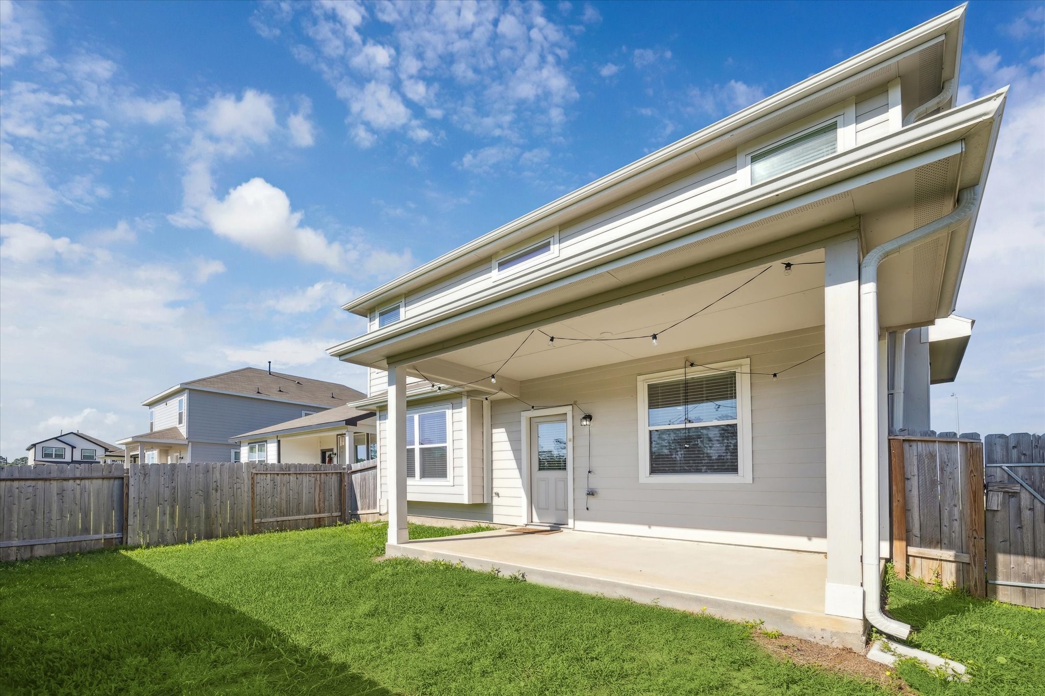 23531 Montague Drive Spring, TX 77373 - Photo 15 of 21 a backyard of a house with table and chairs