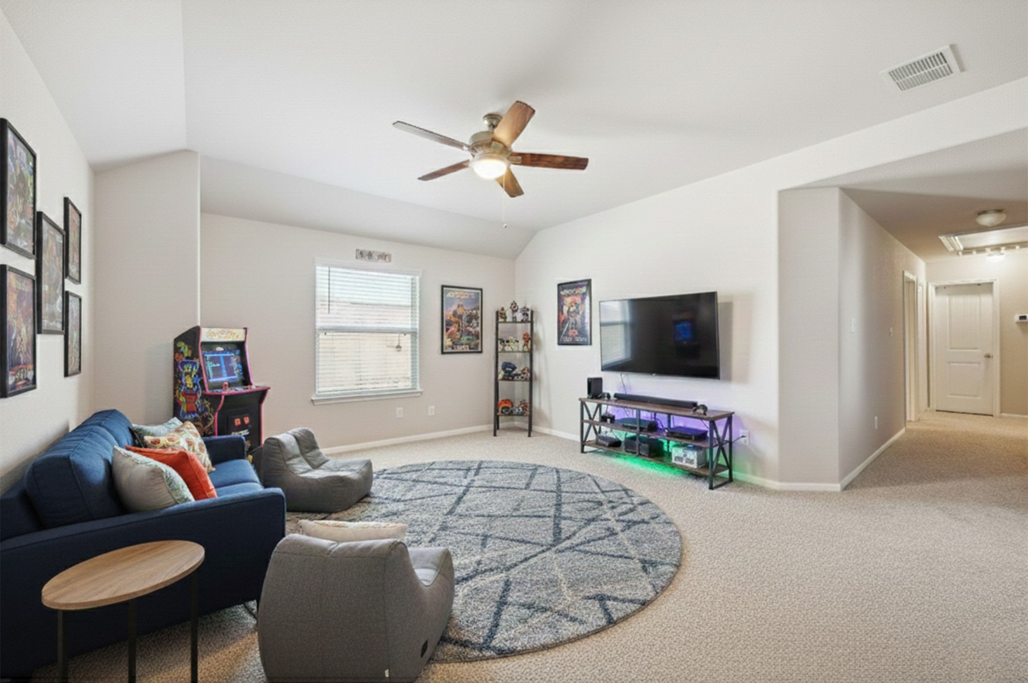 23531 Montague Drive Spring, TX 77373 - Photo 10 of 21 a living room with furniture and a flat screen tv