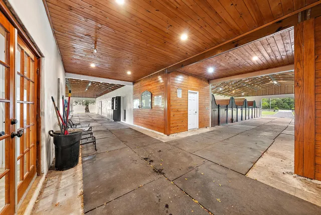 a view of a porch with wooden floor