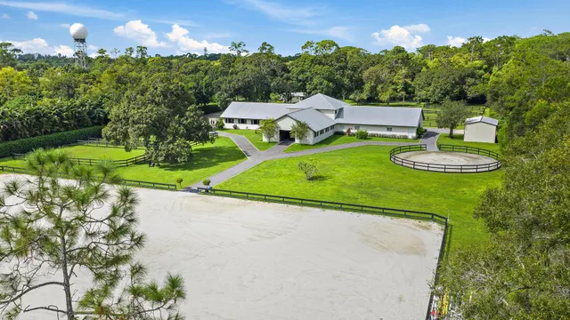 an aerial view of a house with garden space and street view