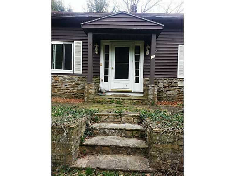 13 Hemlock Road Laughlintown, PA 15655 - Photo 2 of 22 Exterior Front. Beautiful stone surrounds this home. A loving and thoughtful green thumb is all it needs.