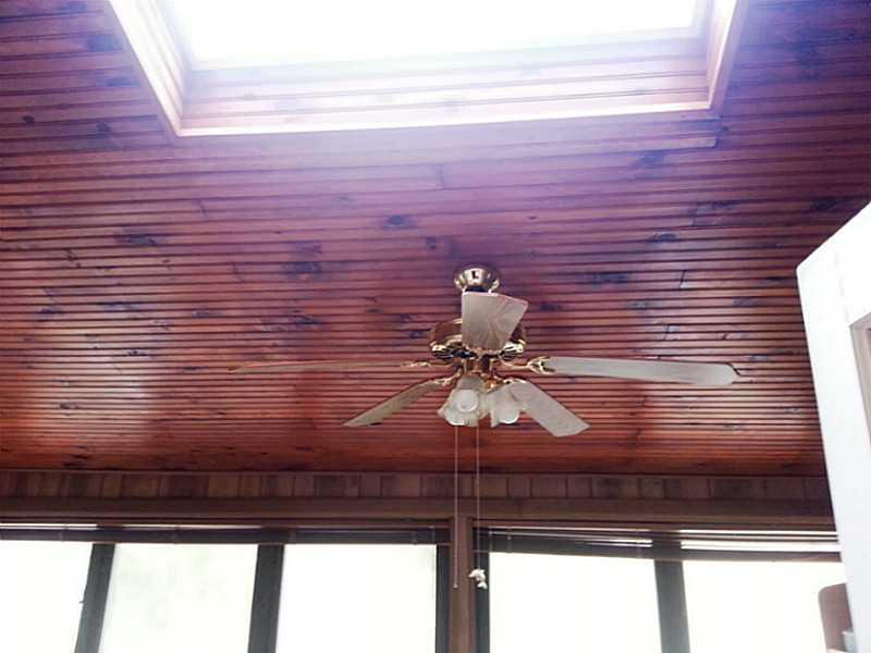 13 Hemlock Road Laughlintown, PA 15655 - Photo 11 of 22 Sunroom. The three season room has a skylight and is lined with windows on three sides. Look at that ceiling!