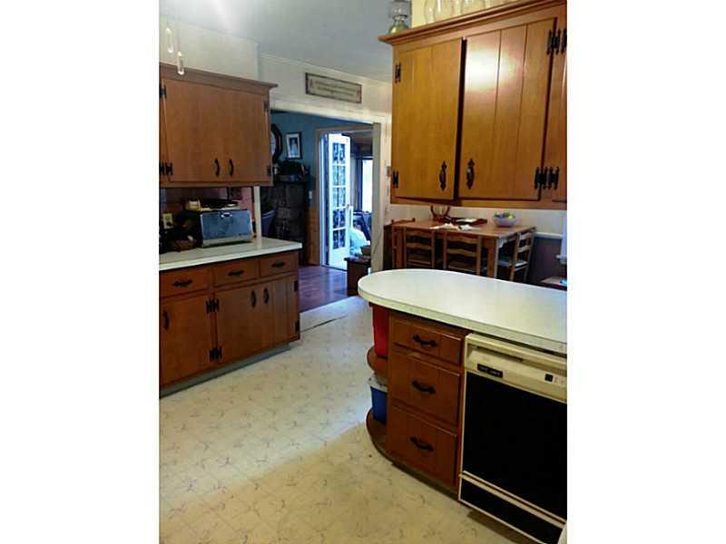 13 Hemlock Road Laughlintown, PA 15655 - Photo 12 of 22 Kitchen. From the stove and sink area of the kitchen, looking towards the dining and living rooms.