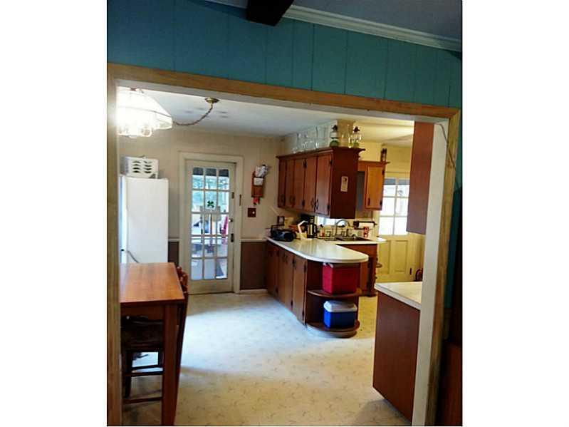 13 Hemlock Road Laughlintown, PA 15655 - Photo 16 of 22 Dining Room. From the living room into the kitchen, dining and a door to the back enclosed porch.
