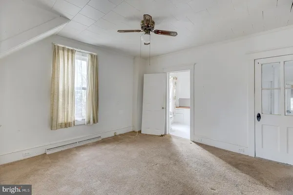 a view of an empty room with a window