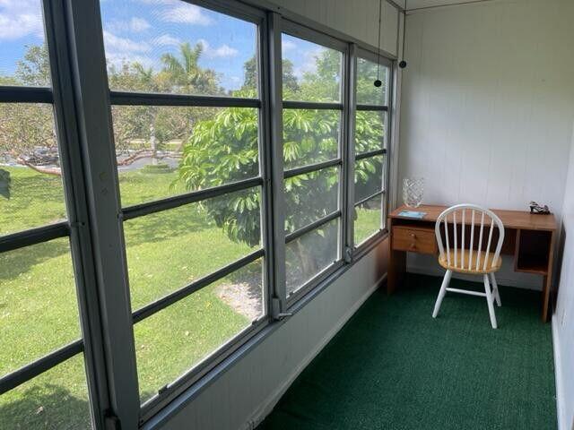 152 Suffolk F Boca Raton, FL 33434 - Photo 15 of 26 a view of a room with chairs and backyard