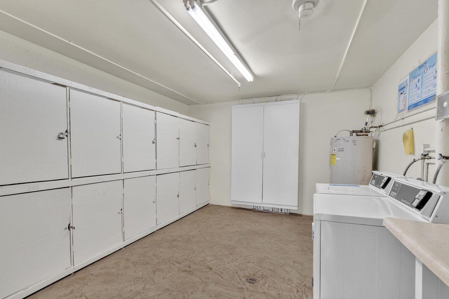 152 Suffolk F Boca Raton, FL 33434 - Photo 17 of 26 a view of a kitchen with white cabinets