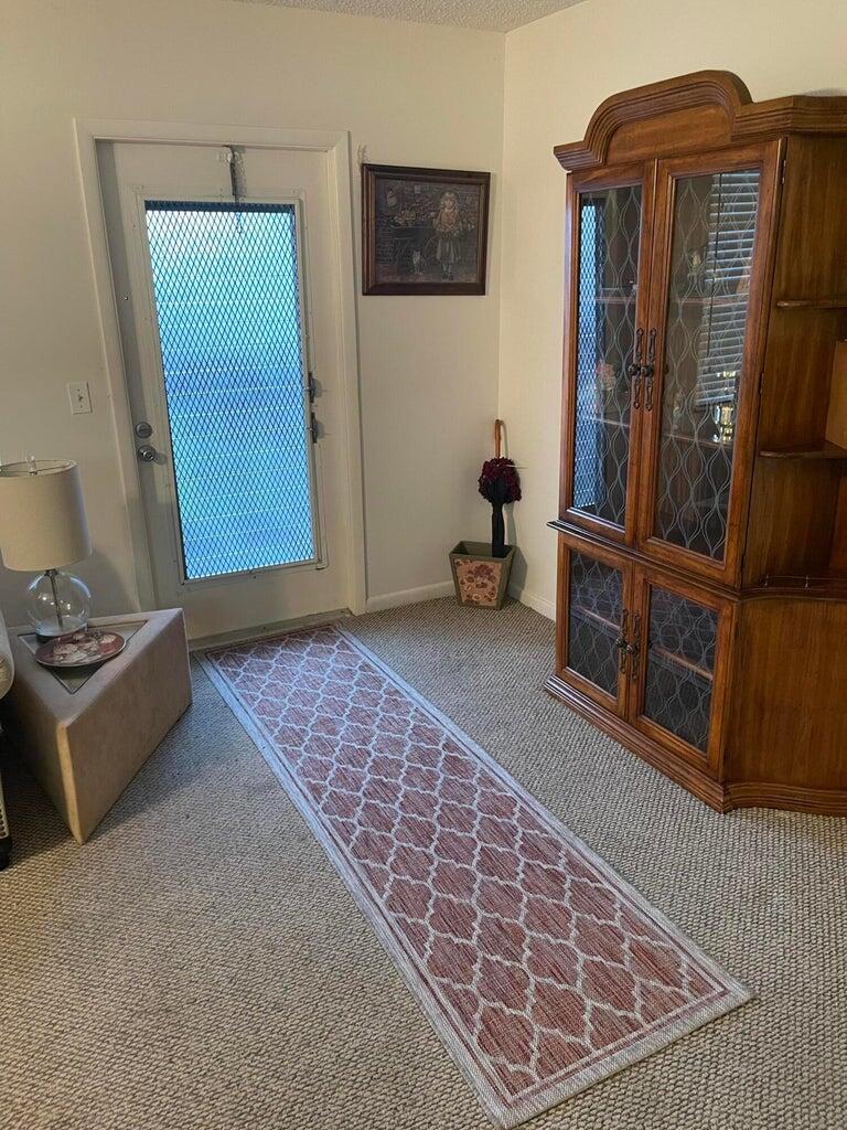 152 Suffolk F Boca Raton, FL 33434 - Photo 2 of 26 a view of livingroom with furniture and workspace