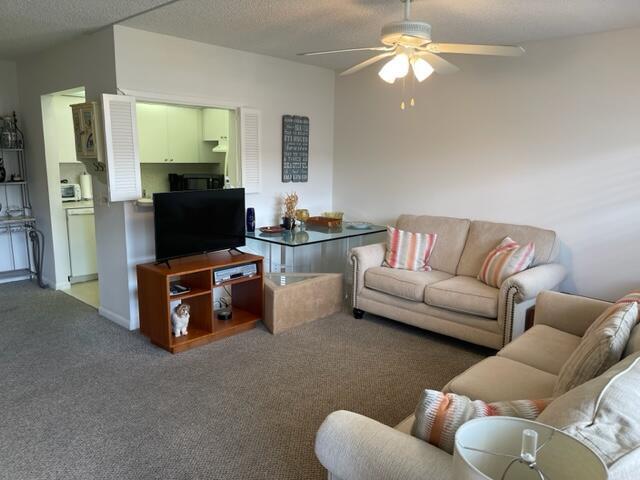 152 Suffolk F Boca Raton, FL 33434 - Photo 5 of 26 a living room with furniture and a flat screen tv