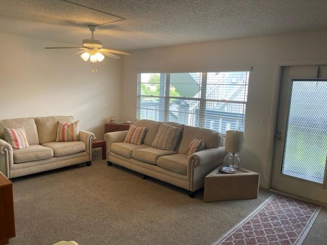 152 Suffolk F Boca Raton, FL 33434 - Photo 7 of 26 a living room with furniture and a window