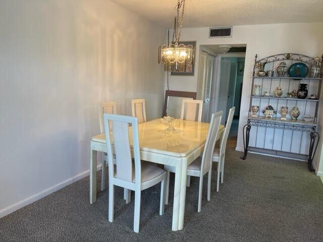 152 Suffolk F Boca Raton, FL 33434 - Photo 8 of 26 a view of a dining room with furniture and window
