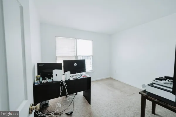 a workspace with furniture and a window