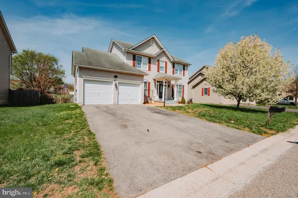 a front view of house with yard