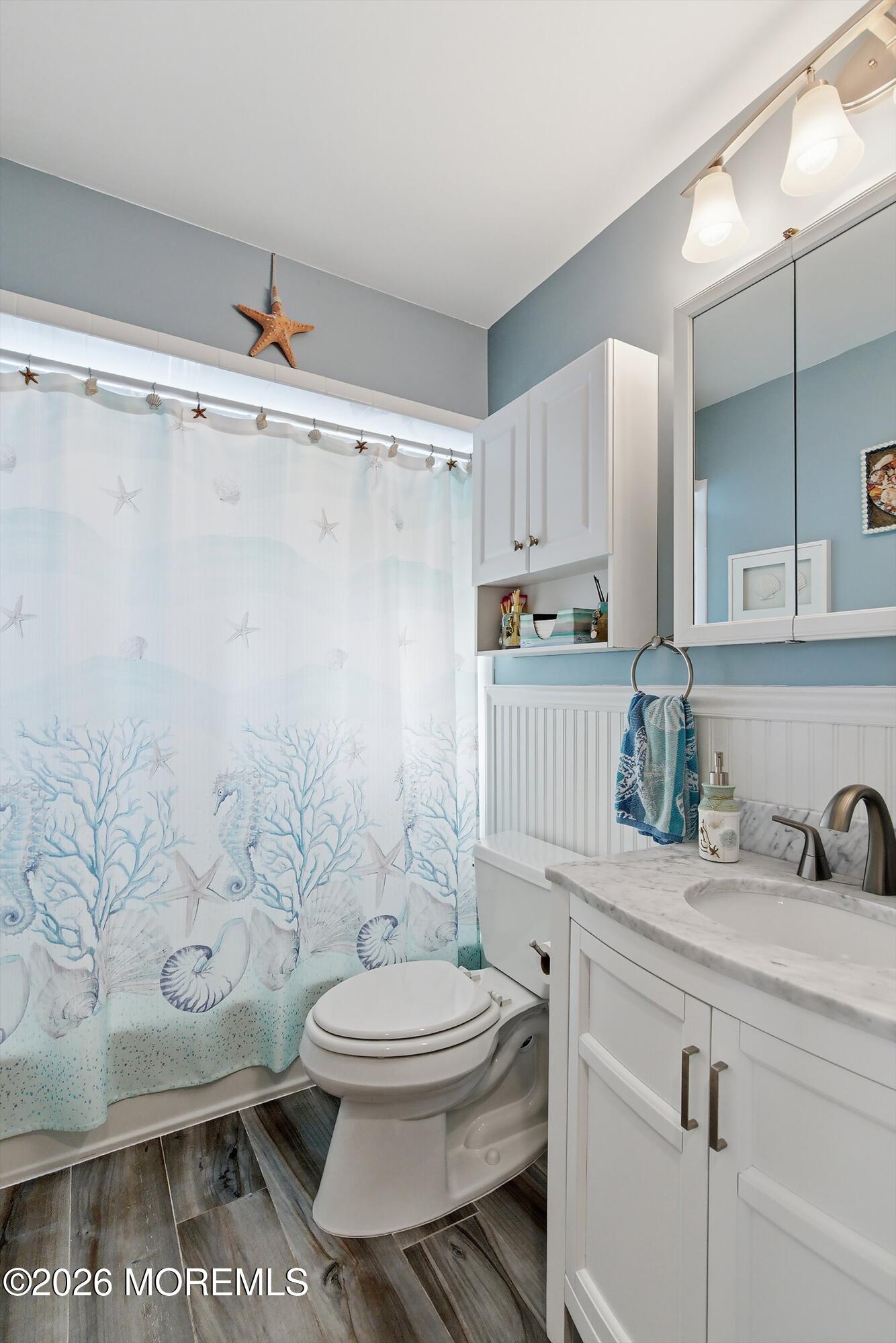 2060 Highway 35, Unit 3 Seaside Heights, NJ 08751 - Photo 13 of 17 a bathroom with a toilet a sink and a shower