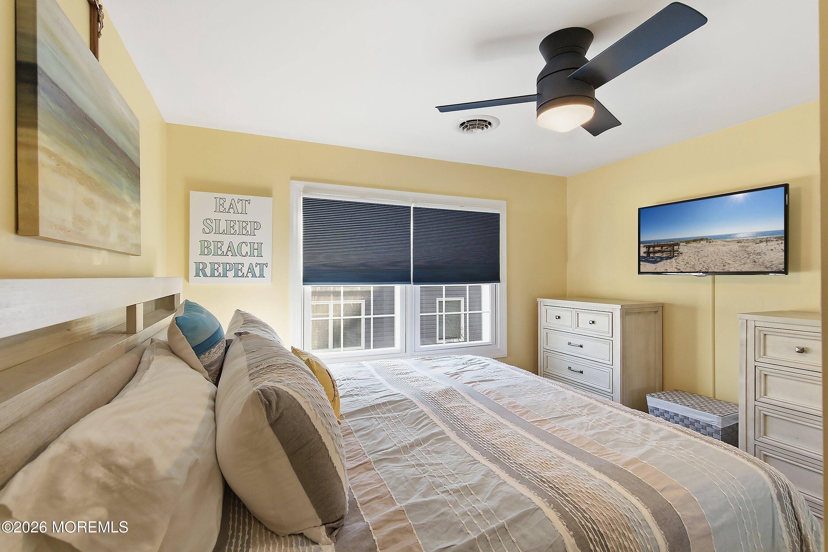 2060 Highway 35, Unit 3 Seaside Heights, NJ 08751 - Photo 15 of 17 a bedroom with a bed and a large window