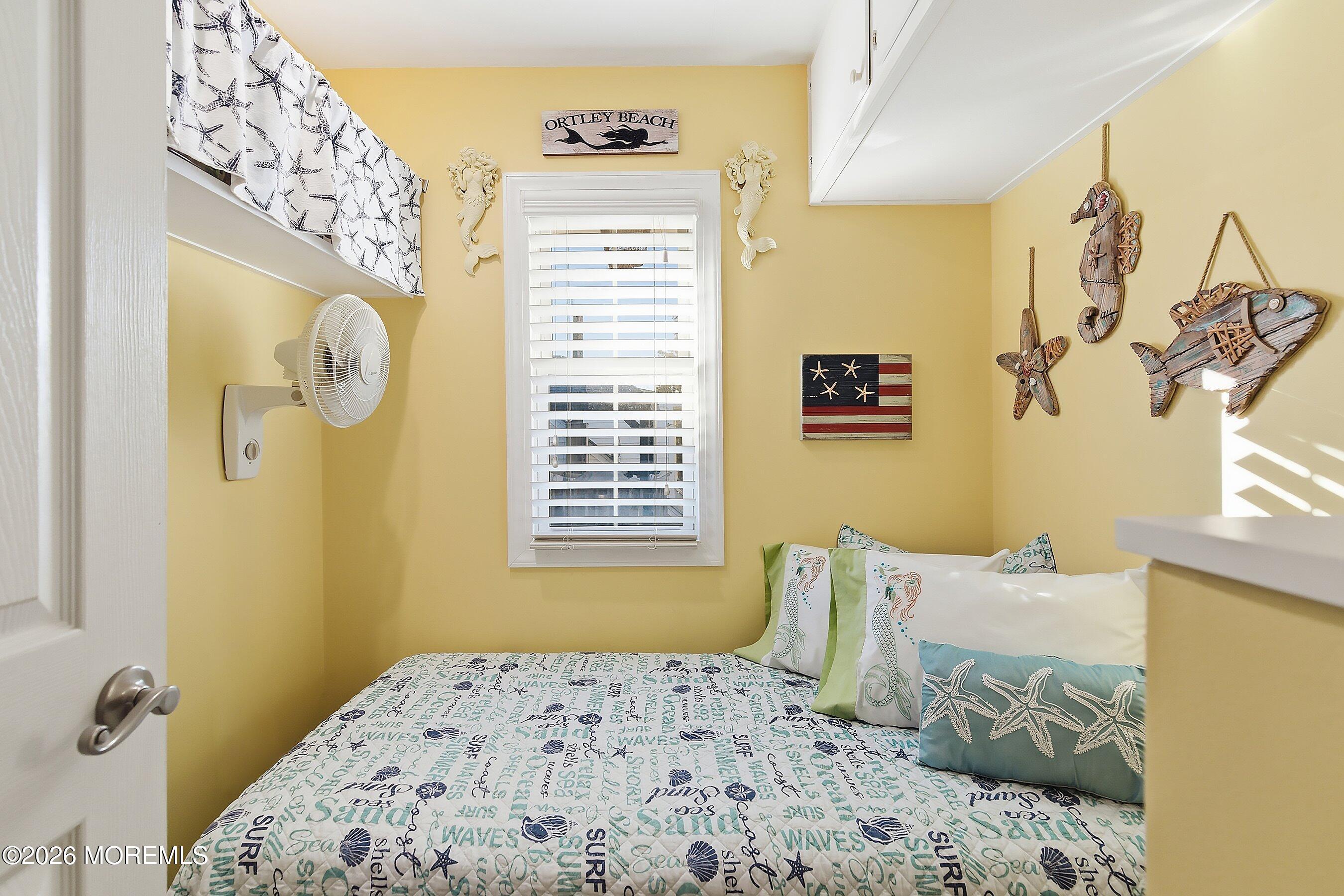 2060 Highway 35, Unit 3 Seaside Heights, NJ 08751 - Photo 16 of 17 a bedroom with a bed and a window