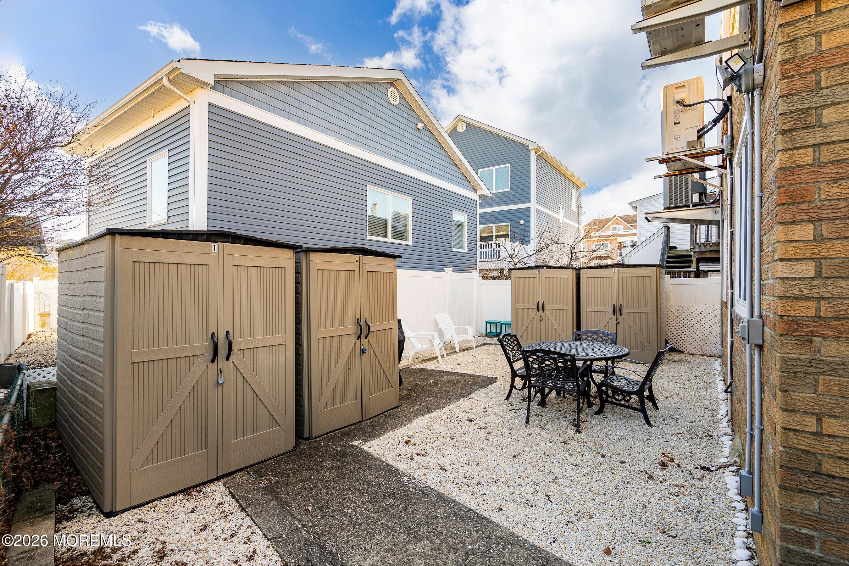 2060 Highway 35, Unit 3 Seaside Heights, NJ 08751 - Photo 17 of 17 a view of a patio with table and chairs and wooden floor