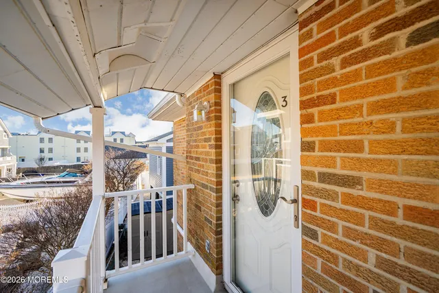 a view of a door and a window