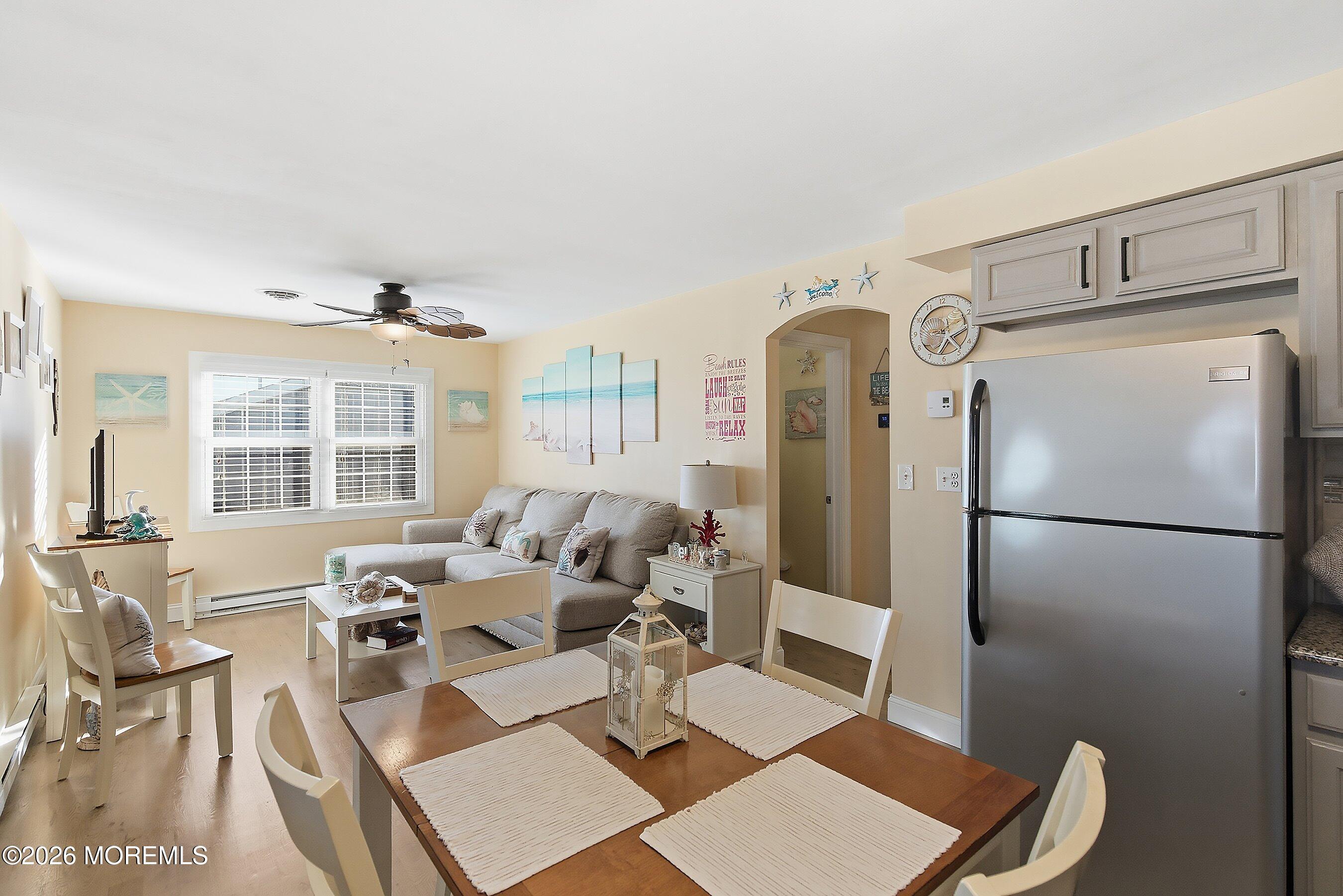 2060 Highway 35, Unit 3 Seaside Heights, NJ 08751 - Photo 10 of 17 a living room with a couch and a table
