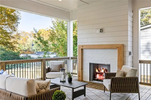 a outdoor living space with furniture and a fireplace