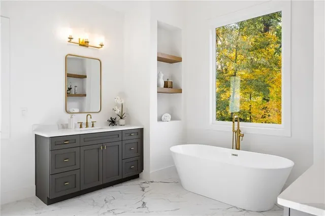 a spacious bathroom with a double vanity sink mirror and window