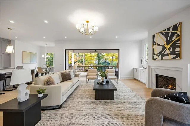 a living room with furniture fireplace and window