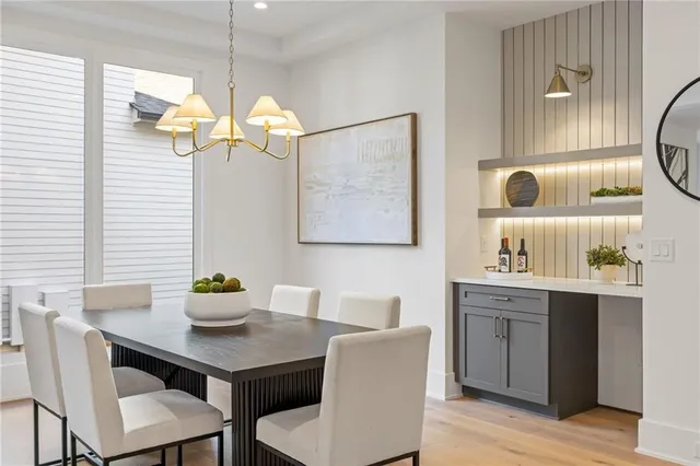 a dining room with a table and chairs