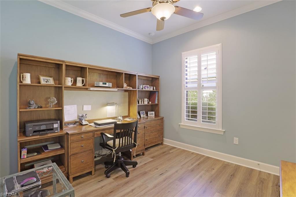 8962 Quarry Drive Naples, FL 34120 - Photo 16 of 35 a workspace with furniture hardwood and a window
