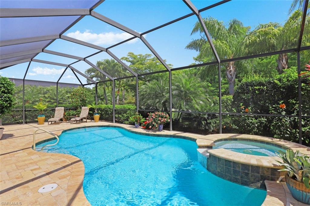 8962 Quarry Drive Naples, FL 34120 - Photo 20 of 35 a view of a swimming pool with a yard potted plants