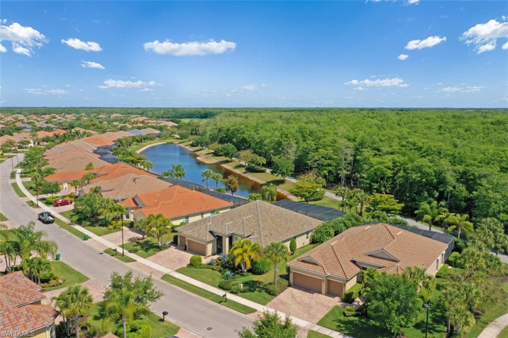 8962 Quarry Drive Naples, FL 34120 - Photo 2 of 35 an aerial view of a house with a garden
