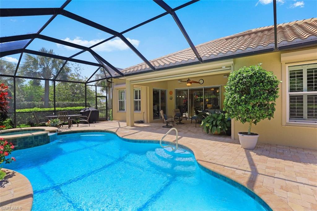 8962 Quarry Drive Naples, FL 34120 - Photo 21 of 35 a view of a house with backyard porch and sitting area
