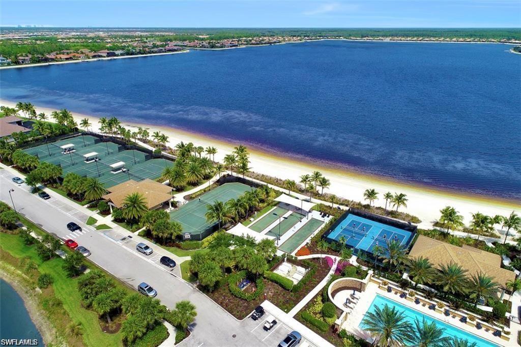 8962 Quarry Drive Naples, FL 34120 - Photo 26 of 35 an aerial view of a house with a lake view