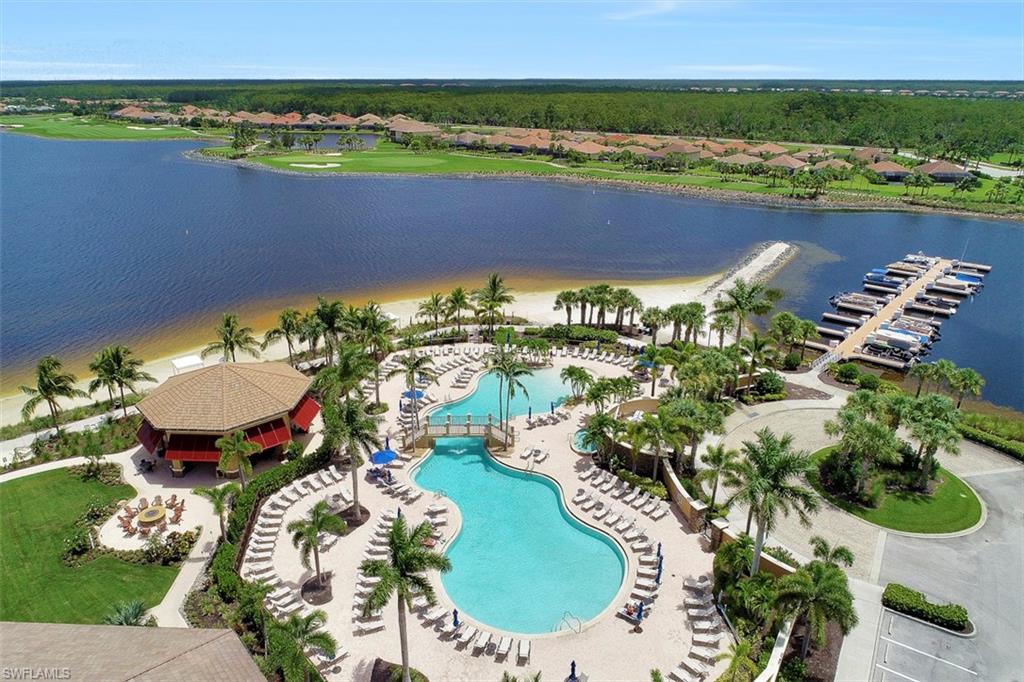 8962 Quarry Drive Naples, FL 34120 - Photo 27 of 35 an aerial view of a house with a lake view