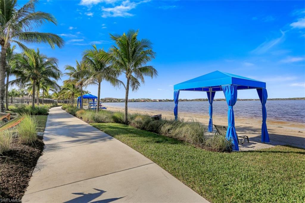 8962 Quarry Drive Naples, FL 34120 - Photo 31 of 35 a view of a garden with a fountain