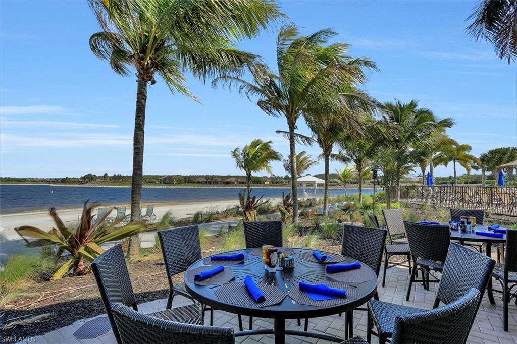 8962 Quarry Drive Naples, FL 34120 - Photo 32 of 35 a view of a chairs and table in patio