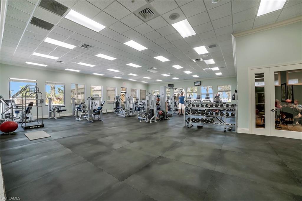 8962 Quarry Drive Naples, FL 34120 - Photo 34 of 35 a view of a room with gym equipment