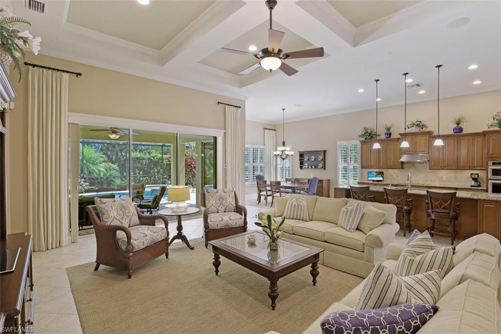 8962 Quarry Drive Naples, FL 34120 - Photo 4 of 35 a living room with furniture and a large window