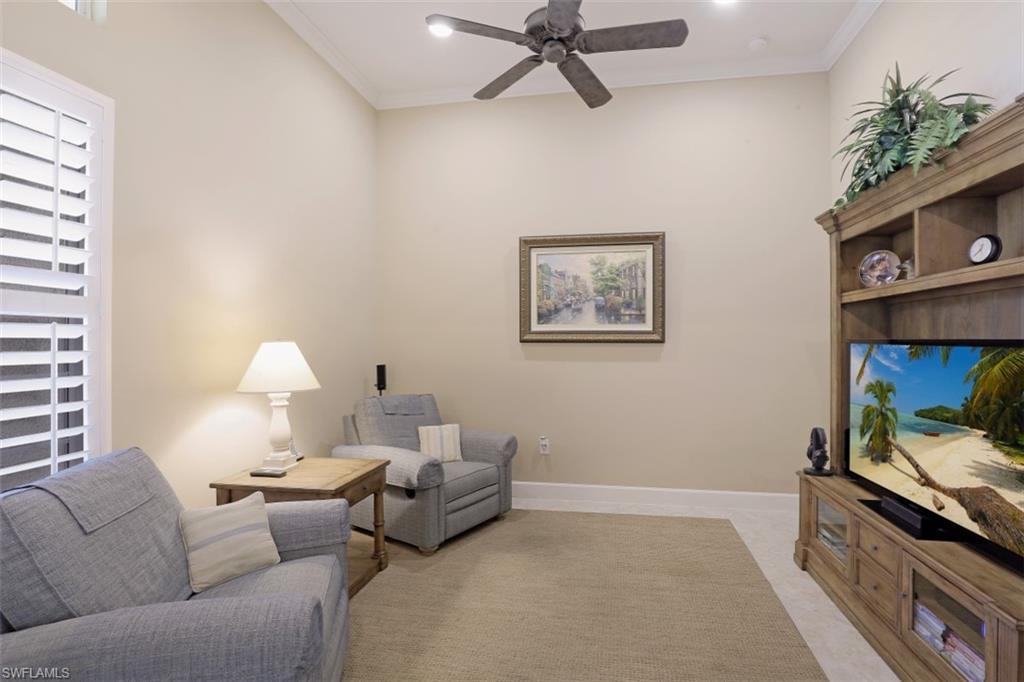 8962 Quarry Drive Naples, FL 34120 - Photo 10 of 35 a living room with furniture and a potted plant