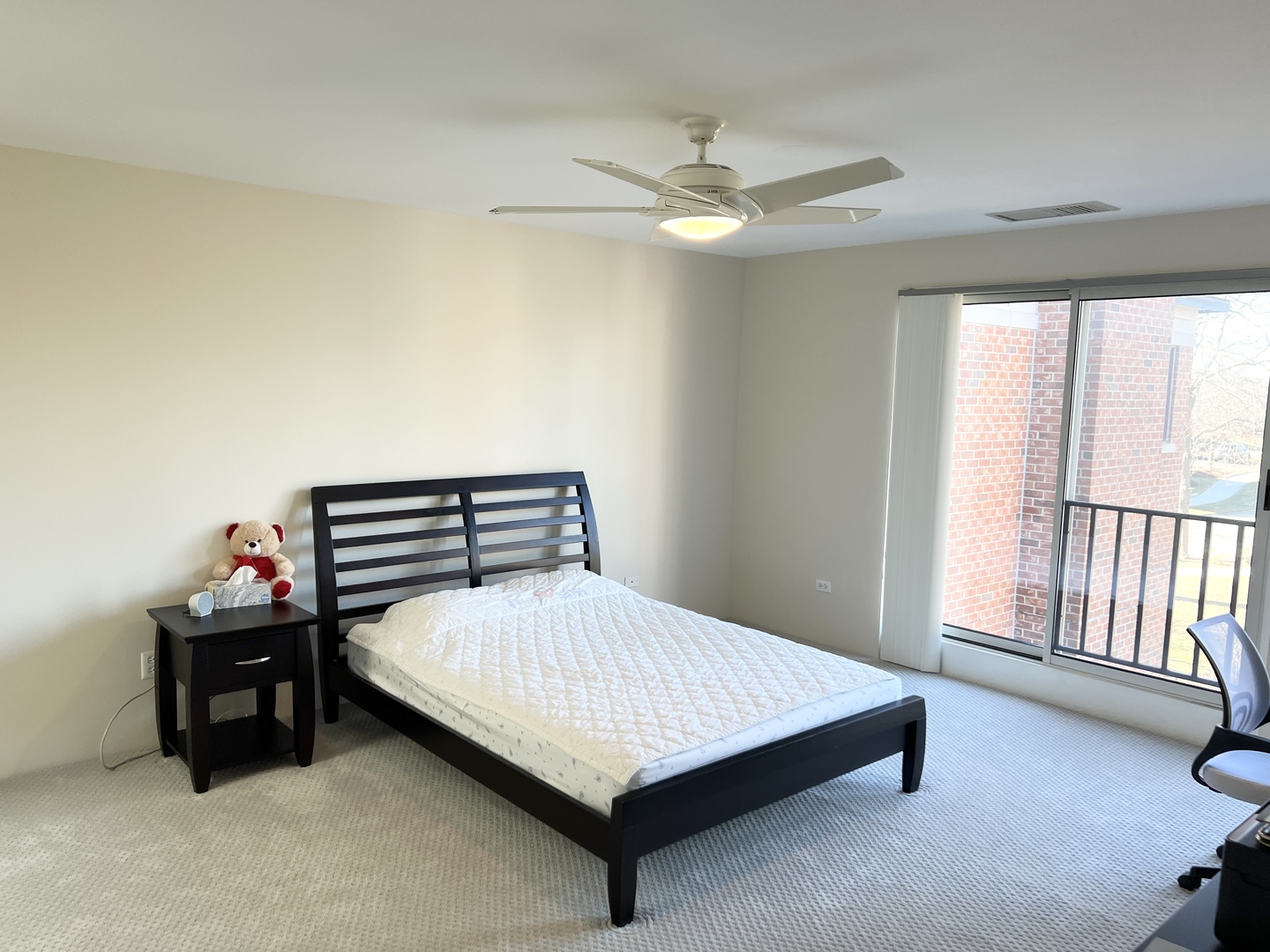 353 Milford Road Deerfield, IL 60015 - Photo 9 of 19 a bedroom with a bed and a chandelier