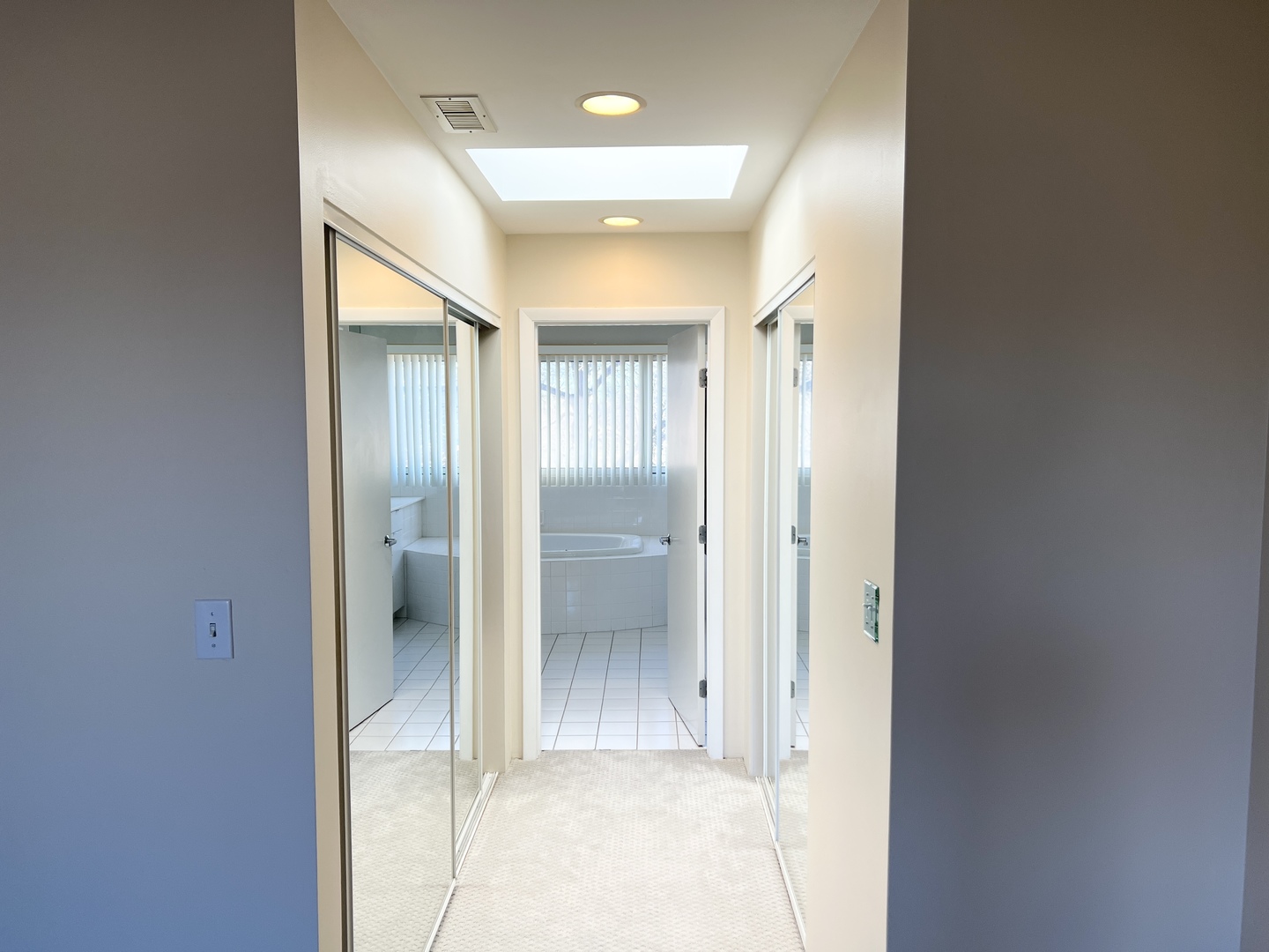 353 Milford Road Deerfield, IL 60015 - Photo 10 of 19 a bathroom with a glass shower door and a mirror