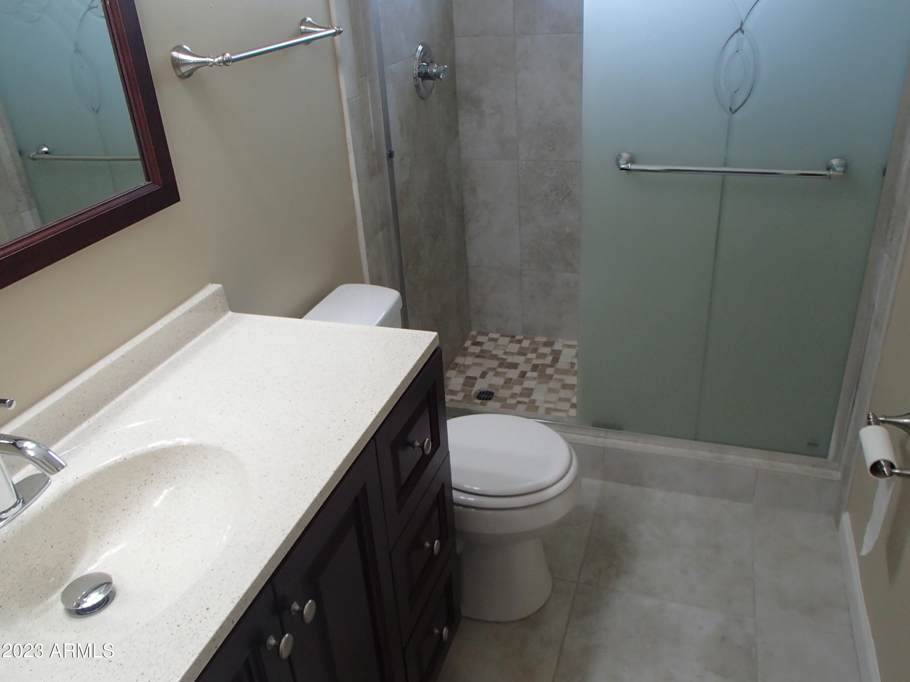 1125 West Colter Street Phoenix, AZ 85013 - Photo 9 of 16 a bathroom with a sink a toilet and shower